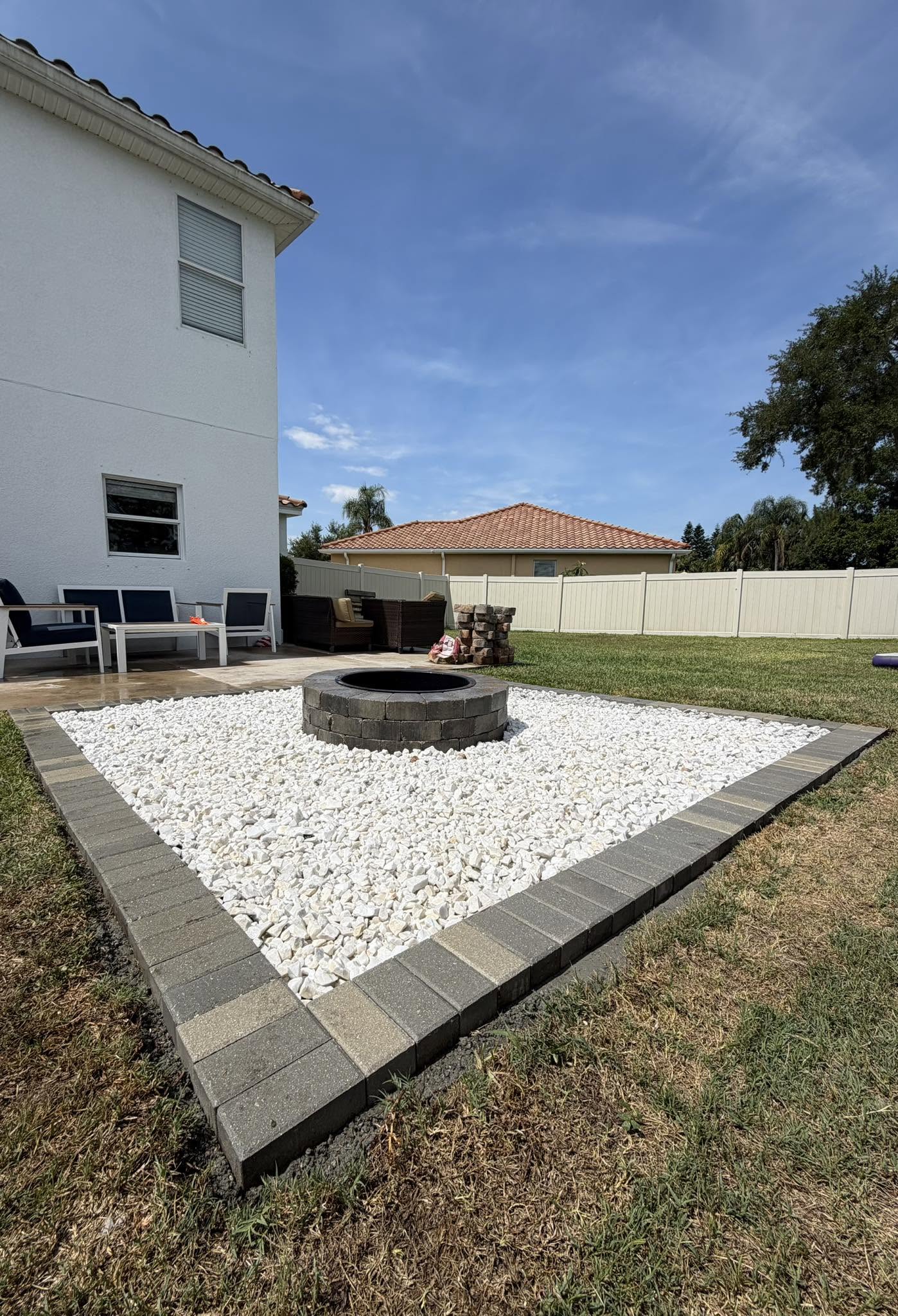 Custom fire pit with paver border